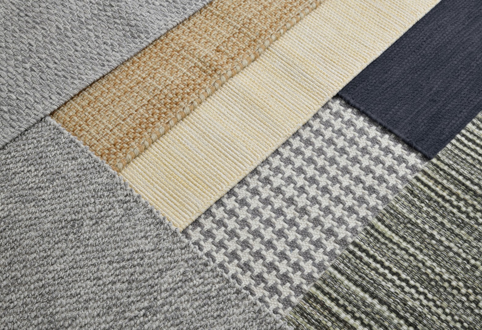 Artisan weaving a rug on a wood loom