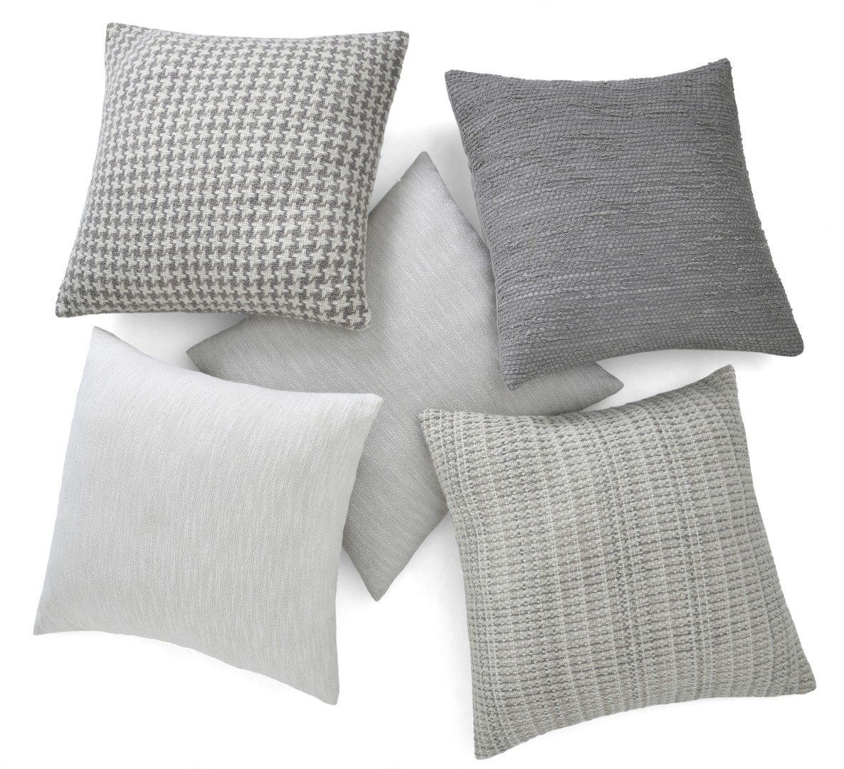 Muted clay tone cushion covers on timber bench